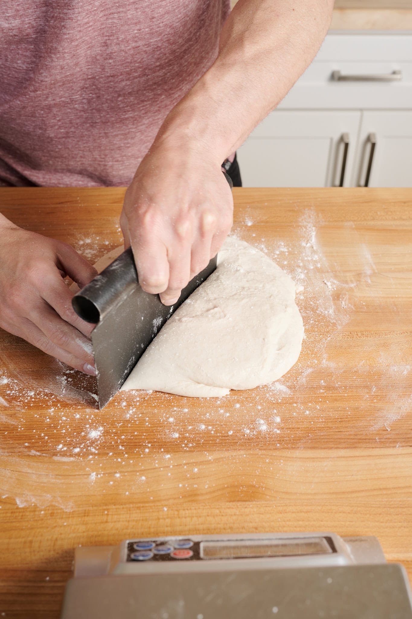 Dividing Detroit-style pizza dough