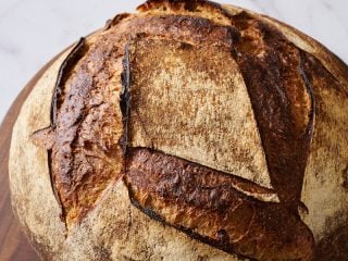 The large size and stunning crust of this miche.