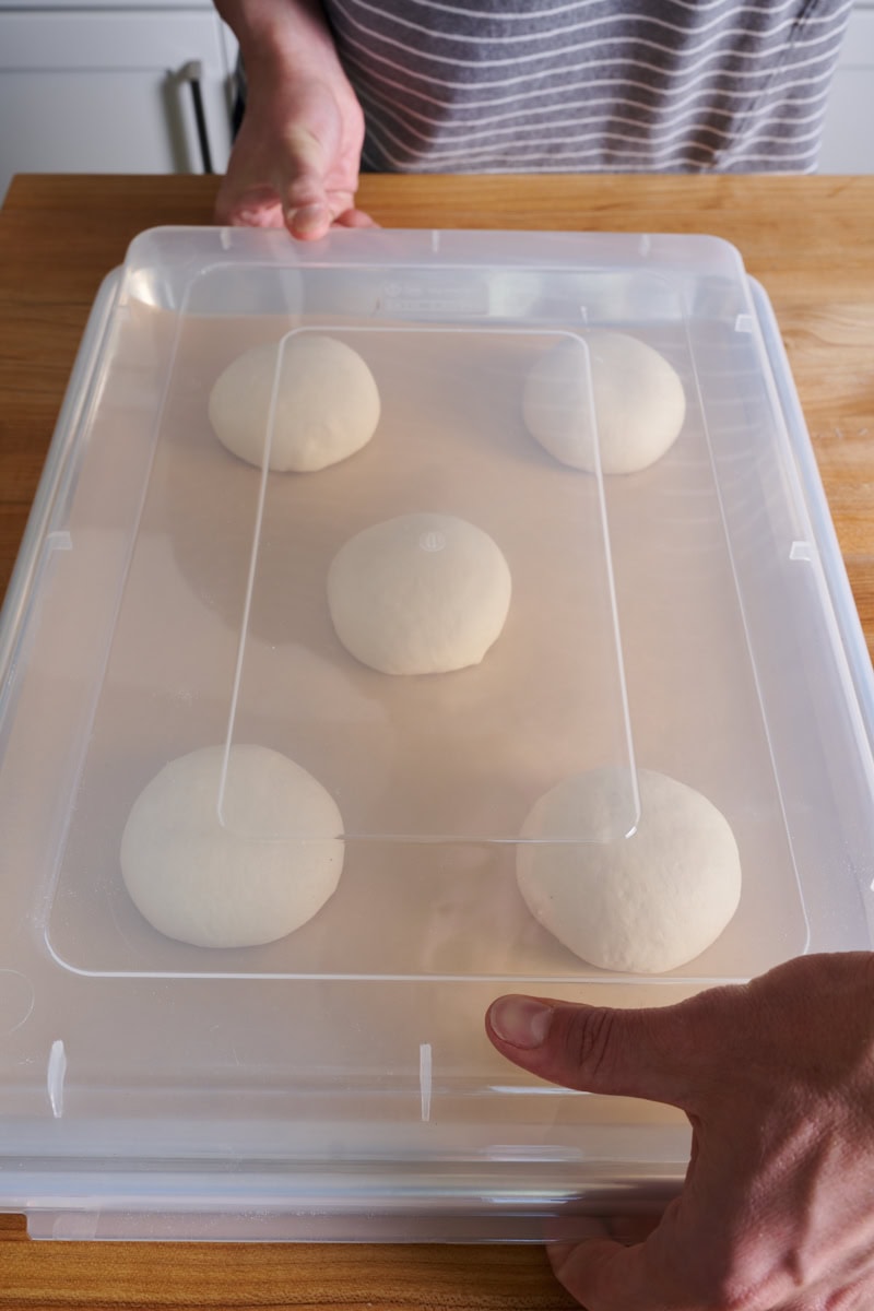 Cover the hamburger buns while proofing.