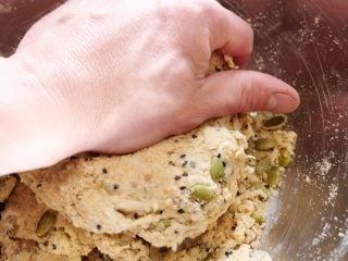 Mixing seeded sourdough discard cracker dough.