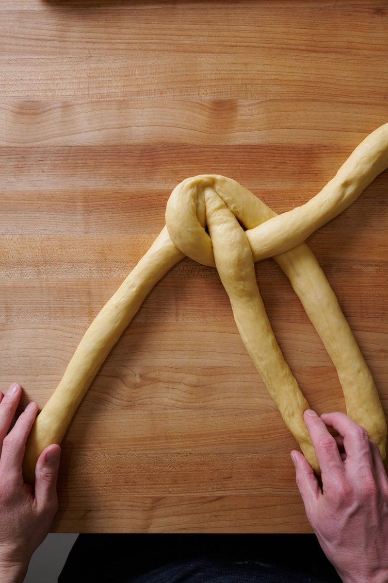 Braiding a 4 strand challah.