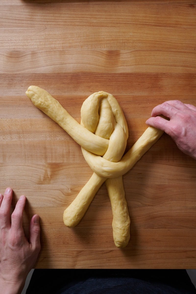 Braiding a 4 strand challah.