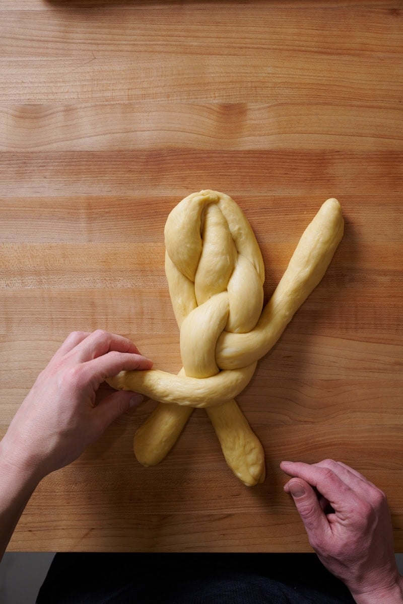 Braiding a 4 strand challah.