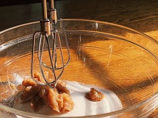 Mixing sourdough discard plum cake ingredients.