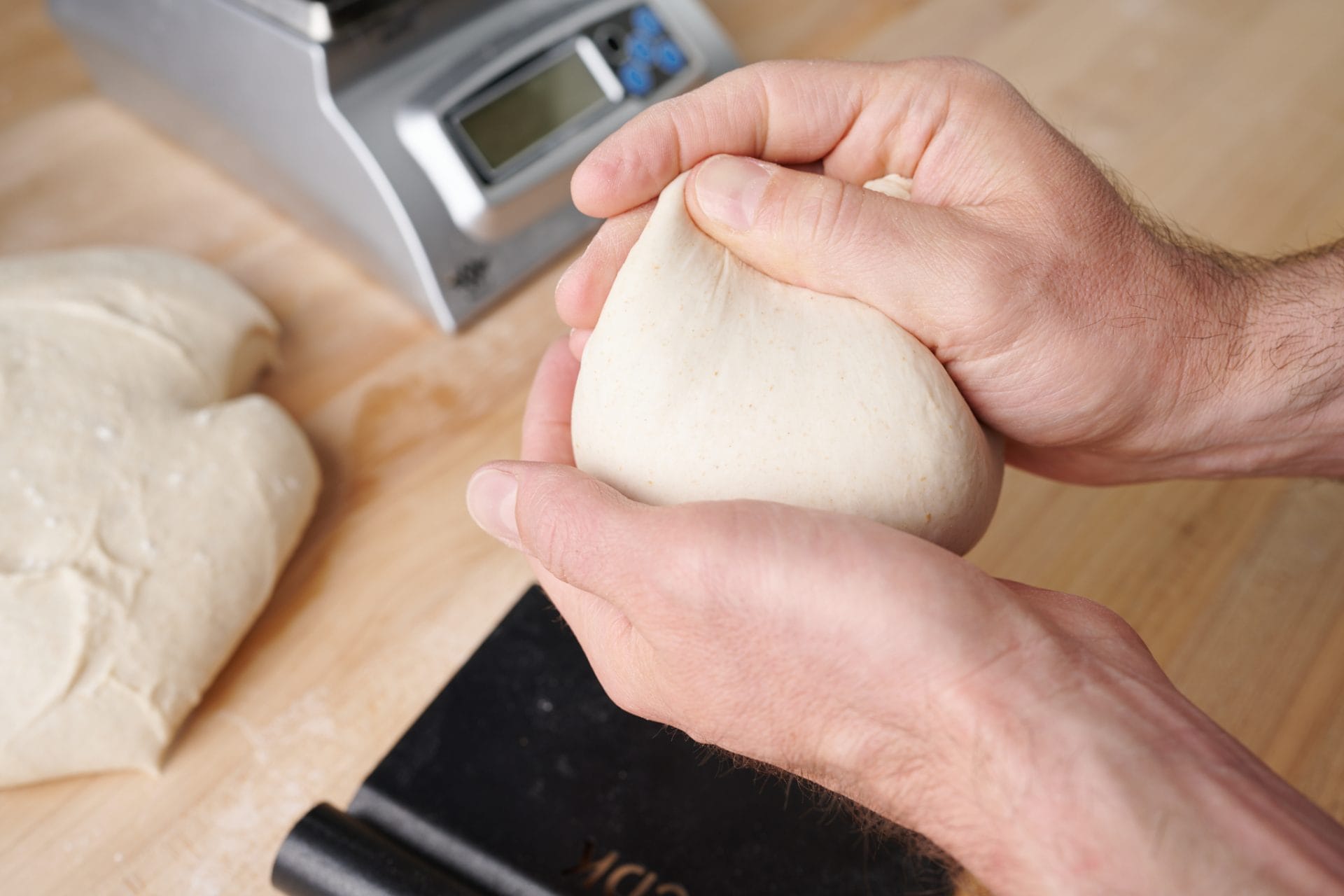 Balling wood-fired sourdough pizza dough